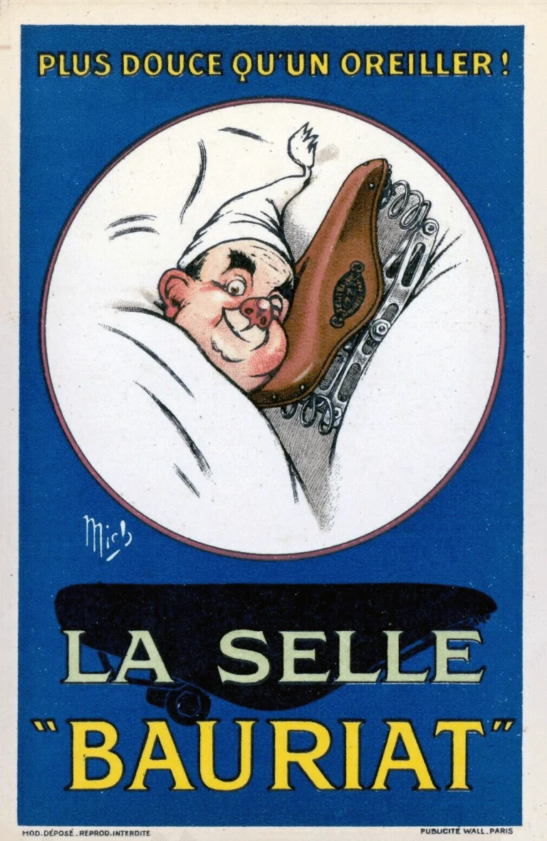 Selle Bauriat advertising postcard signed Mich, captioned Plus douce qu'un oreiller, showing a man in a nightcap in bed hugging a sprung leather saddle like a pillow
