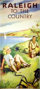 Color lithograph poster of a young couple resting on a grassy headland above a sailing boat with two Raleigh bicycles laid beside them, headed Raleigh To the Country