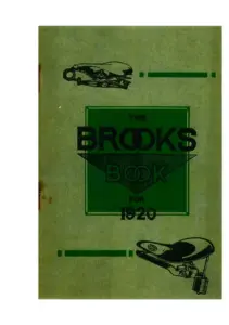 Green printed card catalog cover, foxed along the left edge, printed in dark green and black. A leather cycle saddle on a sprung frame is shown in silhouette at the upper left and a large padded motor cycle saddle on coil springs at the lower right, each balanced by a short rule bar. At the centre, within a bordered panel, the words THE BROOKS BOOK FOR 1920, the word BROOKS set in the house wedge-shaped logotype.