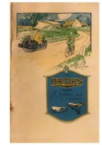 Colour lithographed cover. A country road curves between hedges towards a thatched cottage and trees under a pale sky; a motor cyclist with a sidecar rides towards the viewer on the left and a cyclist in green rides away on the right. Below the scene a blue and gold shield-shaped panel reads The BROOKS BOOK of Saddles and Equipment, with two saddles drawn at its foot.