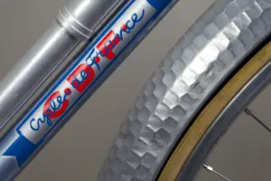 Cycles de France down tube script in red and blue on the pale metallic blue frame of the 1948 randonneuse, alongside the alloy frame pump