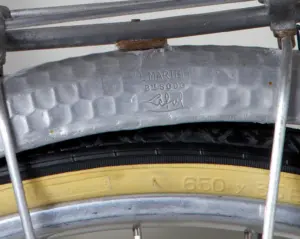 LE MARTELÉ Bté SGDG Lefol stamp on the hammered alloy fender of the 1948 Cycle de France randonneuse, above a tire sidewall reading 650 x 35 B