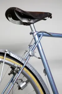 Seat cluster of the 1948 Cycle de France randonneuse, with a drum-bodied Cyclo manette clamped to the seat stay and the rear cantilever brake straddle wire below
