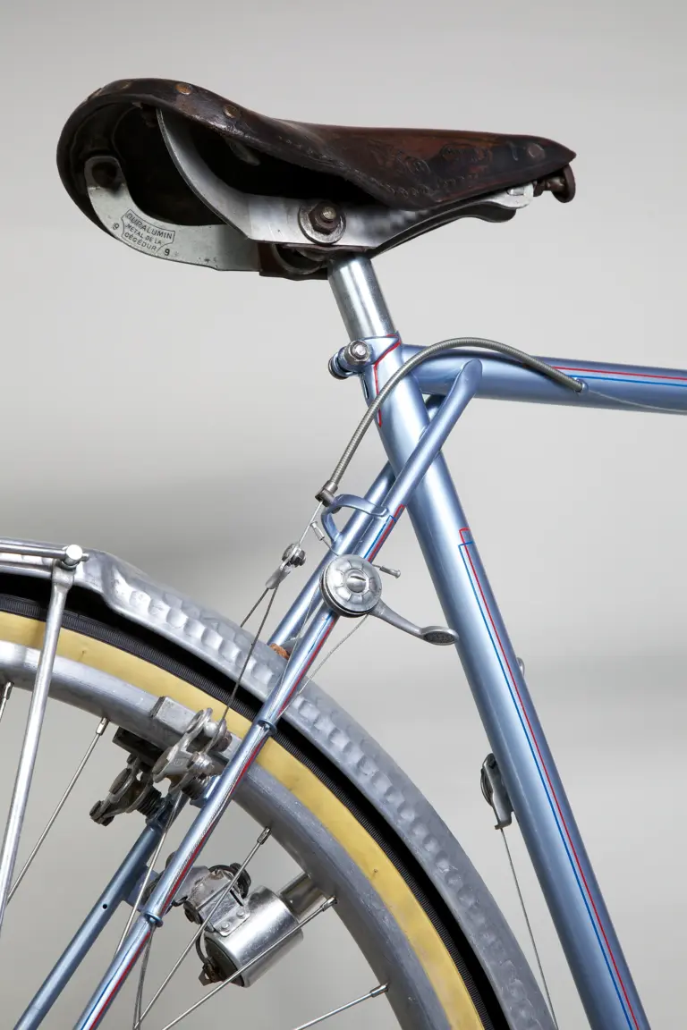 Seat cluster of the 1948 Cycle de France randonneuse, with a drum-bodied Cyclo manette clamped to the seat stay and the rear cantilever brake straddle wire below
