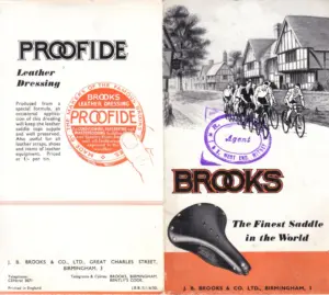 Folded leaflet spread, the left panel headed PROOFIDE Leather Dressing with an orange and white tin graphic, the right panel carrying the BROOKS wordmark over a line drawing of club cyclists passing a half-timbered inn, a sprung saddle photograph and a purple dealer's rubber stamp.
