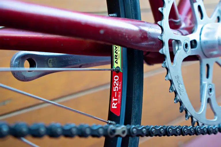 Araya RT-520 double wall 700C rim decal on the Team Fuji, with the reverse of the Sugino crank arm behind it