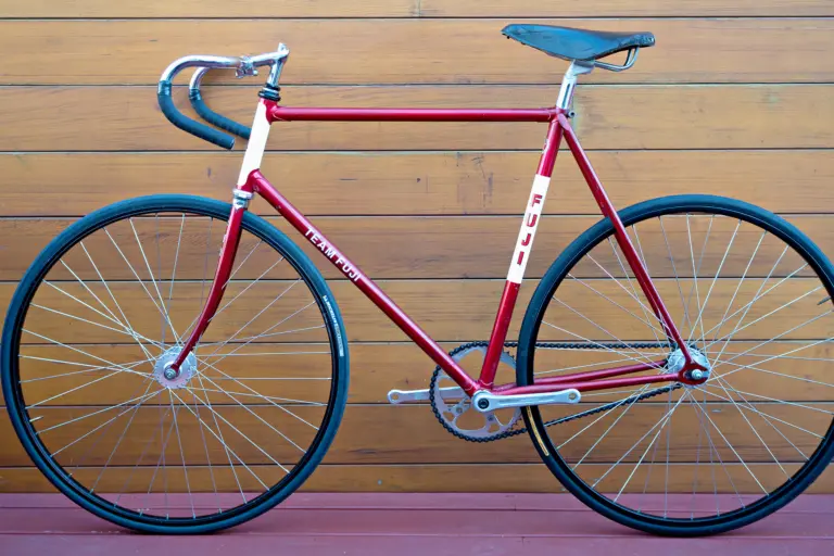 Non-drive-side profile of the 1970s Team Fuji track bicycle, showing the FUJI seat tube panel and the Nitto track handlebar