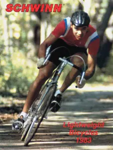 Catalog cover photograph of a cyclist in a red jersey riding through woodland, overprinted Schwinn Lightweight Bicycles 1983