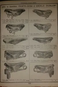 Page 113 of the Établissements Fernand Simon supplier catalog, headed Selles en Caoutchouc Texto-Gom et Idéale Dunlop, showing ten rubber topped saddles with model numbers from 6750 to 6805 and their prices