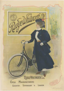 Rudge-Whitworth poster of about 1897: a young woman in a navy cycling costume and a veiled hat with a red feather stands beside a drop-frame lady's bicycle, looking up at a board on the wall lettered Rudge-Whitworth Ltd. beside an open-hand badge, with RUDGE-WHITWORTH LTD., CYCLE MANUFACTURERS, COVENTRY, BIRMINGHAM & LONDON at the foot.