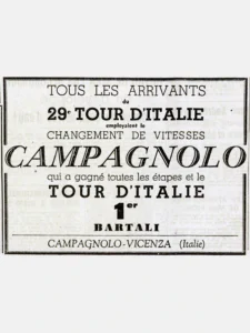 A ruled newspaper advertisement in type alone: "Tous les arrivants du 29e Tour d'Italie employaient le changement de vitesses", CAMPAGNOLO in large outline capitals across the box, "1er Bartali" and "Campagnolo-Vicenza (Italie)".