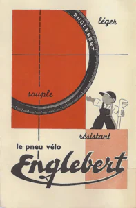 Englebert advertisement from Englebert Vélo-Magazine, November 1951, page 2: a drawing of a quarter-turn of a black treaded bicycle tire branded with the maker's name, curving across a red-orange panel crossed by fine black guide lines, with a cartoon mechanic in a cap and overalls standing on a pale salmon block beside it, pointing at the tire and holding a large pipe wrench.