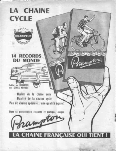Brampton advertisement from L'Officiel du cycle, 7 December 1957, page 16: a large drawn hand holds up two chain boxes, one showing a racing cyclist in a cap bent over a track bicycle above a chain marked "BRAMPTON COURSE" and the other a waving tourist on a bicycle with mudguards and a carrier above a chain marked "BRAMPTON FRANCE," each box carrying the Brampton script name.