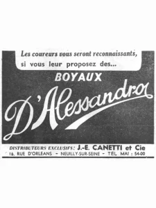 Canetti advertisement from L'Officiel du cycle, 6 July 1957, page 29: the D'Alessandro name sweeps across a solid black panel in a large white script with a long looped underscoring tail, beneath the word BOYAUX in white capitals.