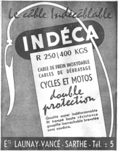 Indéca advertisement from L'Officiel du cycle, 6 April 1964, page 30: a pale tilted label printed with the cable's qualities sits on a field of diagonal hatching crossed by a pale looping curve, like a cable with a crimped end, with the Indéca name reversed out of a black rounded plaque at its head.