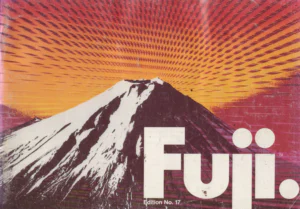 The front cover of the Fuji catalog, a snow-capped Mount Fuji drawn in white and deep maroon against a sky of radiating orange and magenta bands, with the large white "Fuji." wordmark at lower right and the edition line beneath it.