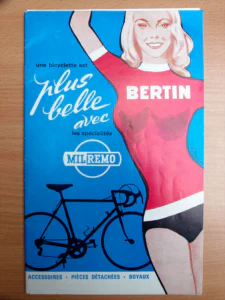 Front cover of the Milremo catalog: a painted smiling blonde woman with one arm raised, in a red jersey lettered "BERTIN" and black shorts, beside the Milremo roundel and the dark silhouette of a racing bicycle on a blue ground.